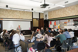 Photo of teacher teaching students. Link to Gifts of Appreciated Securities